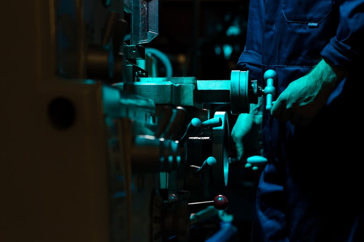 Operator working with industrial manufacturing equipment