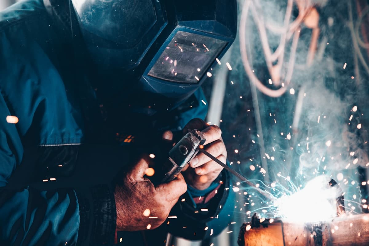 Skilled welder at work in a manufacturing facility